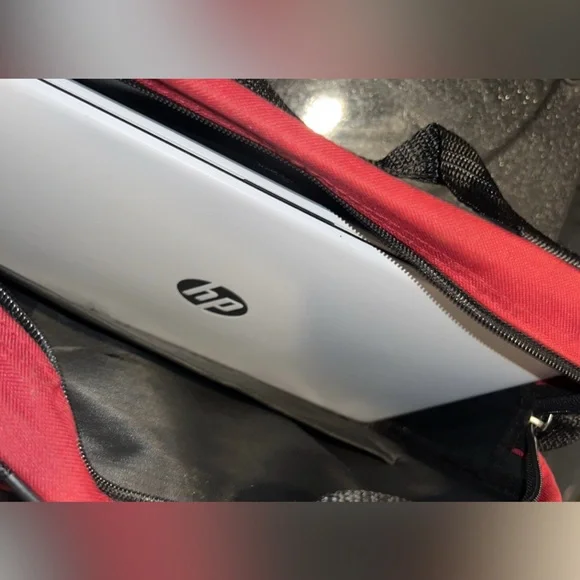 HP Silver Laptop with Black and Red Accessories